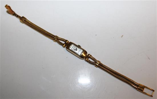 Ladies 18ct gold watch on plated strap